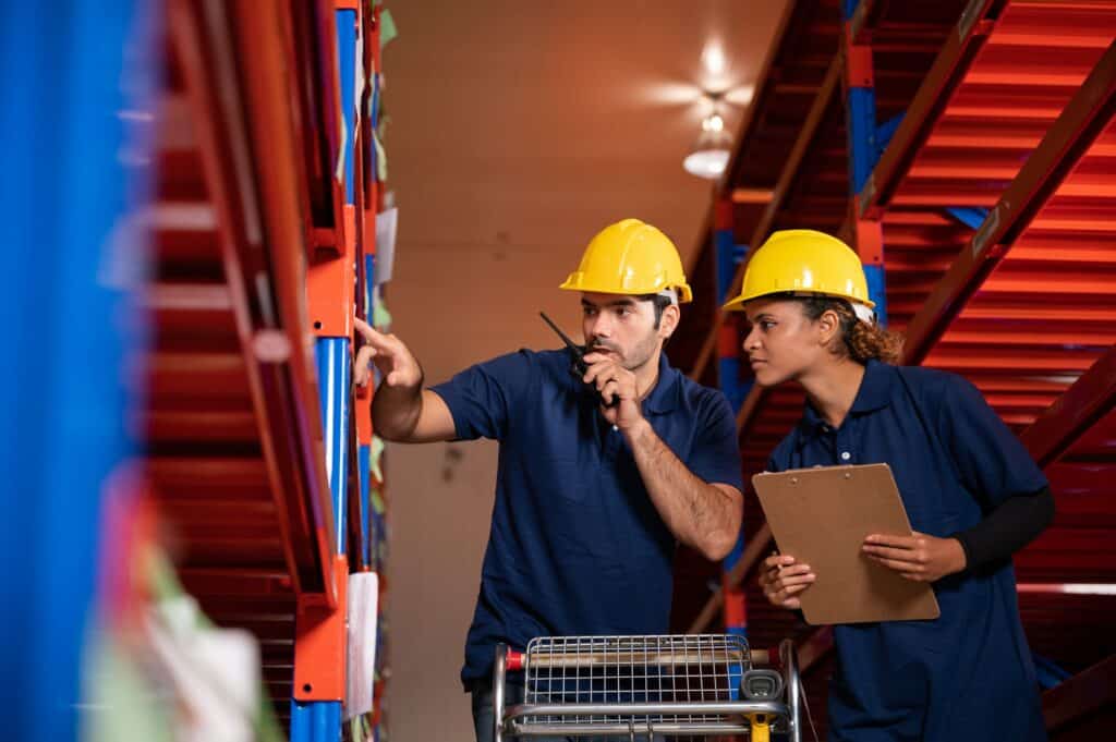 African American worker person working with safety in warehouse logistic factory